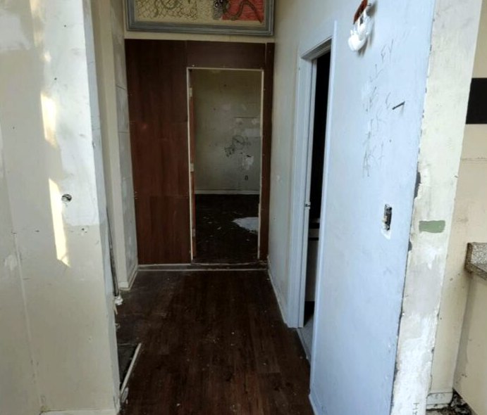 Apartment hallway and doorway waiting for a turnover