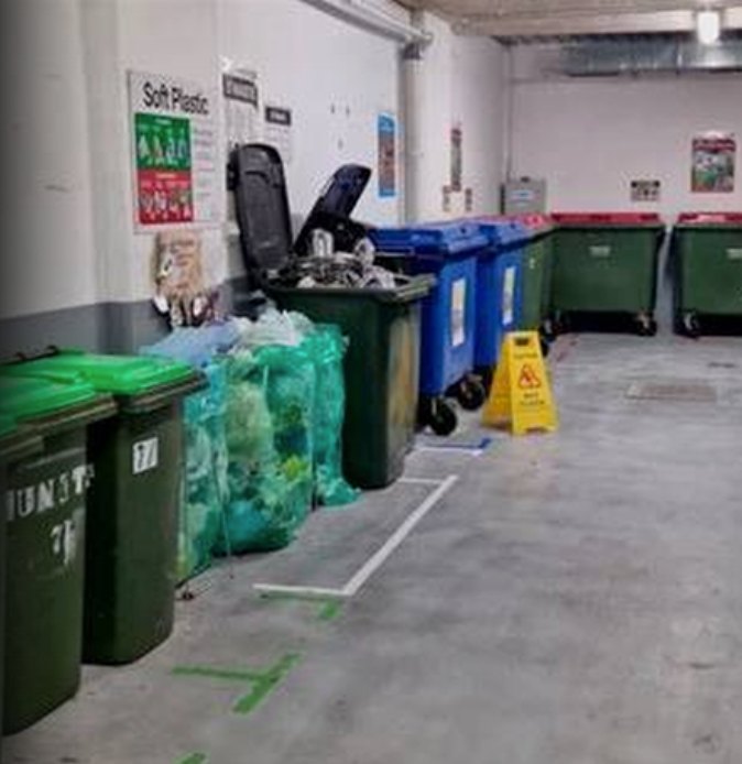 Garbage room with sorted waste and recycling bins